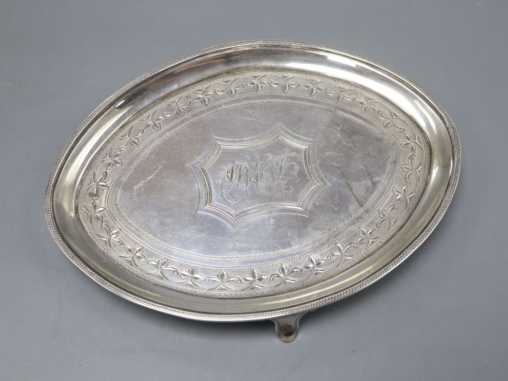 A George III silver teapot stand, with bright cut engraving, London 1792, 18cm, 3oz.